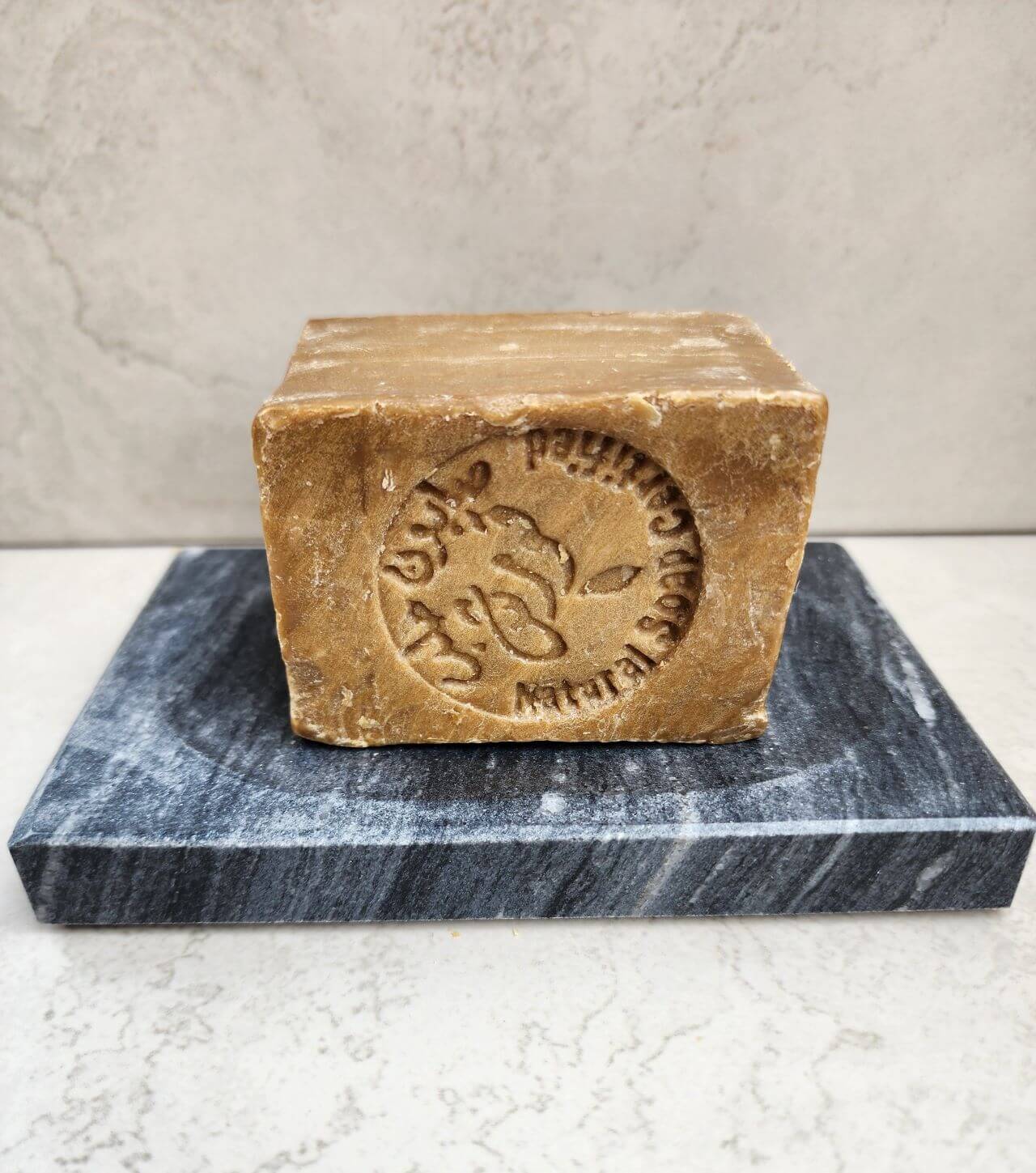 Luxurious marble soap dish with a handcrafted soap bar, perfect for adding elegance to your bathroom decor.