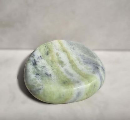 Elegant green and gray marble soap dish with natural variations, perfect for adding sophistication to bathroom decor.