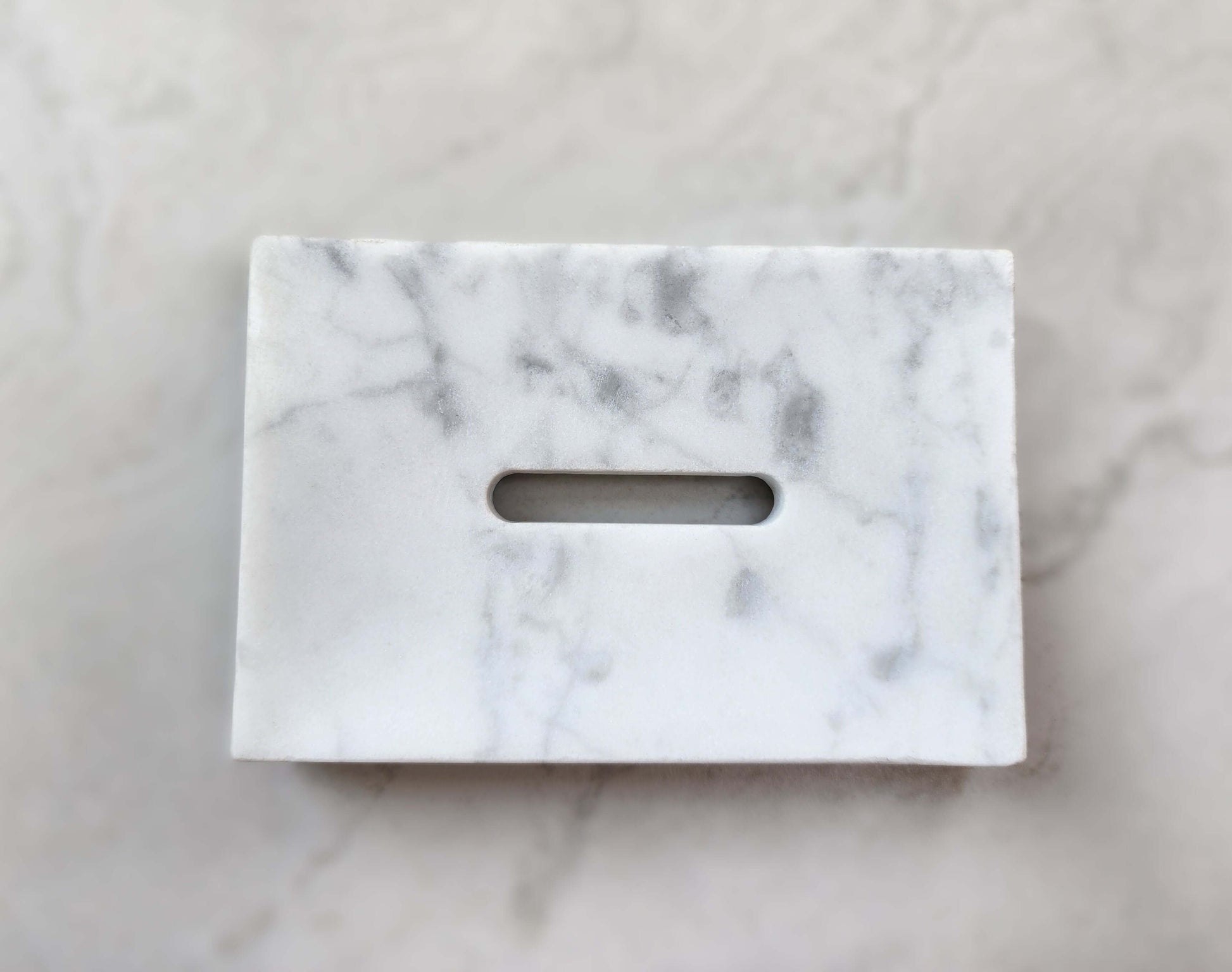 Elegant marble soap dish with natural veining, perfect for adding sophistication to your bathroom decor.