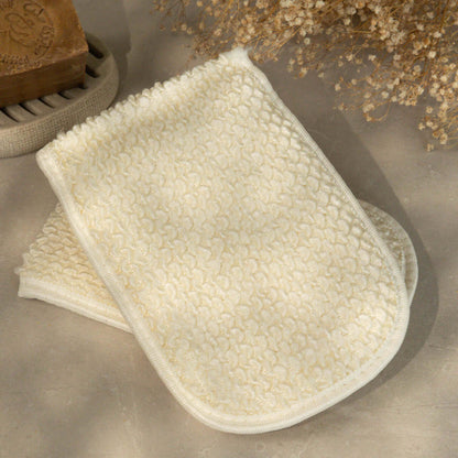 Natural loofah paired with Aleppo soap bar for a nourishing bath routine.